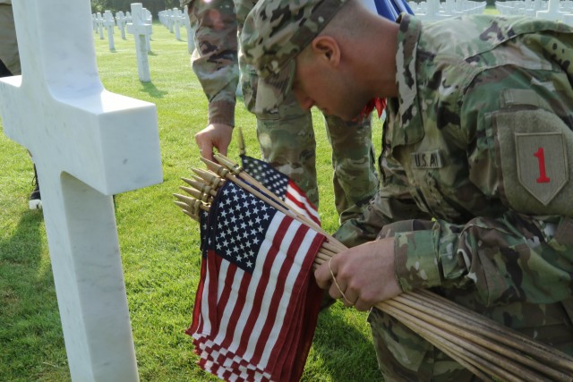 Commemorating origins of America's First Division 'Big Red One' Soldiers walk along battlefield