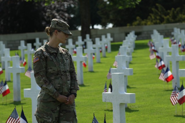 Commemorating origins of America's First Division 'Big Red One' Soldiers walk along battlefield