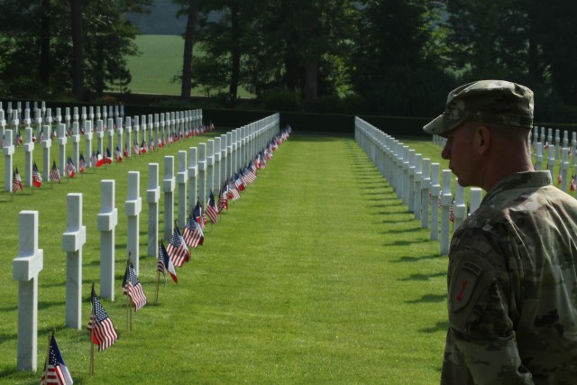 Commemorating origins of America's First Division 'Big Red One' Soldiers walk along battlefield