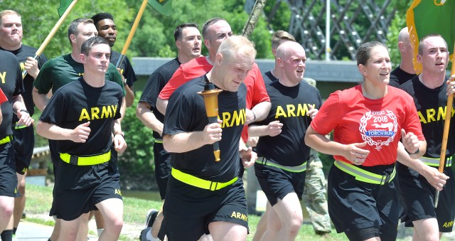 Members of the 97th Military Police Battalion, USAG Fort Riley, participated in the Special Olympic Flame of Hope as it traveled thrfough the area May 31.