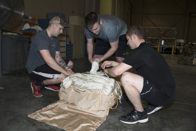 Airborne testers conduct airdrop tests of new container delivery system