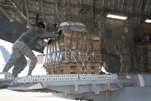 Airborne testers conduct airdrop tests of new container delivery system