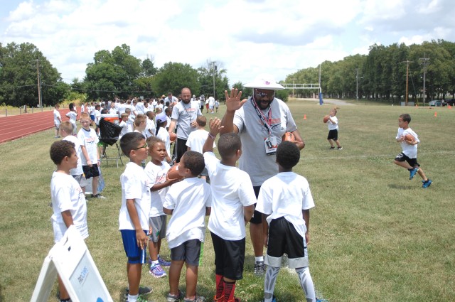 Military kids learn football fundamentals
