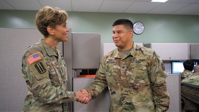 Dental Health Command-Pacific Soldier receives coin from Army Surgeon General