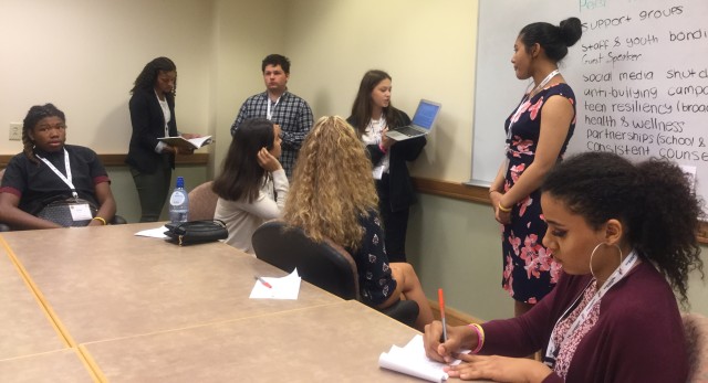 Teens work in small groups and teams