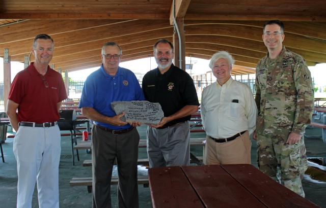 Officials Hold Signed Piece of Jetty Stone During Navigation Project Event