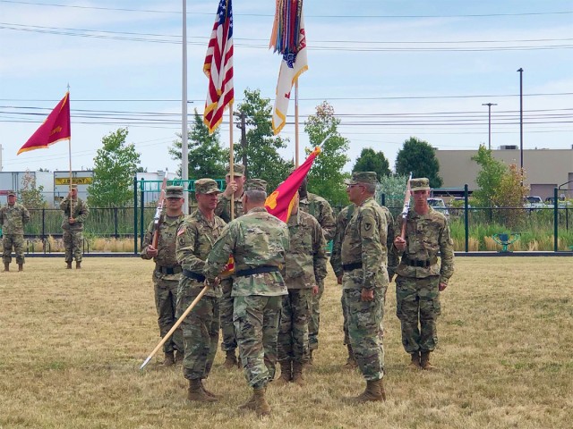 Gen. Perna passes the TACOM colors to Maj. Gen. Mitchell