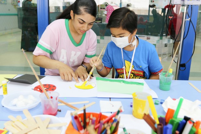 Soldiers spend the day playing with kids at Kuwait hospitals