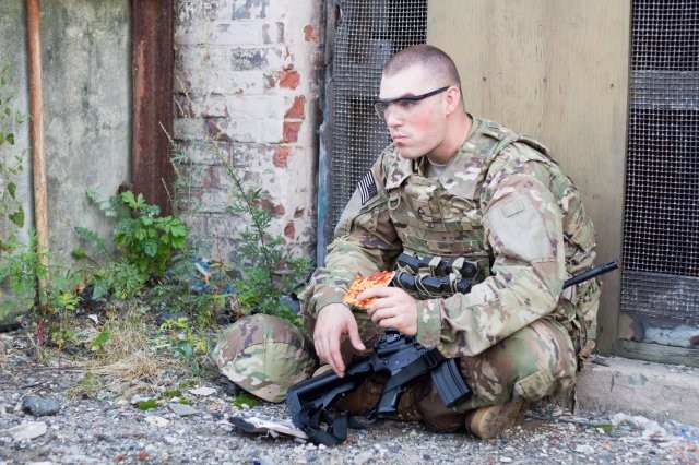 Soldier eating MRE pizza