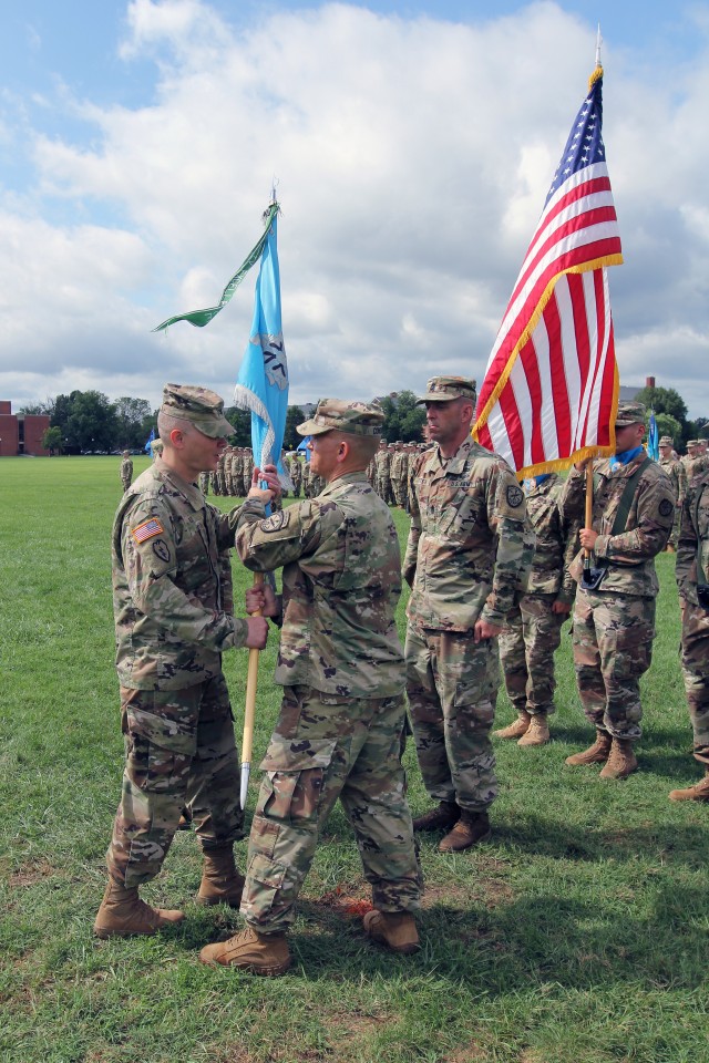 Lt. Col. Considine passes the Bn. Colors to Col. Vile
