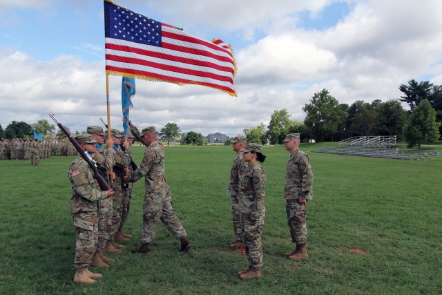 Command Sgt. Maj. Potter returns the Bn. Colors to the color bearer