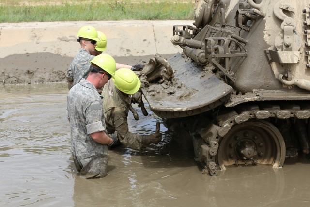 Students build skills in tracked vehicle recovery during RTS-Maintenance course at Fort McCoy