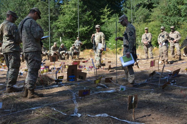 Soldiers from 4th Battalion, 23d Infantry and Charger Company, 1st Battalion, 5th Infantry Regiment conduct a combined arms rehearsal