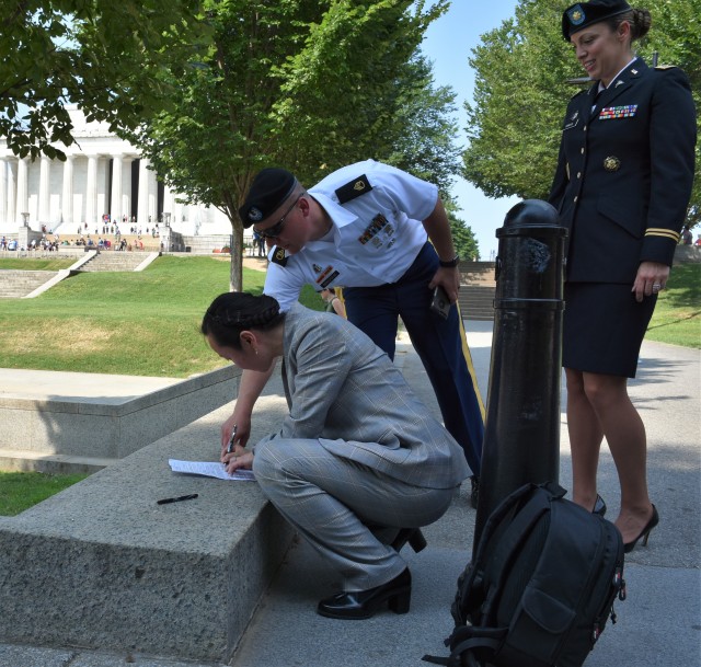 Army's Newest Doctor Signs In on the Mall