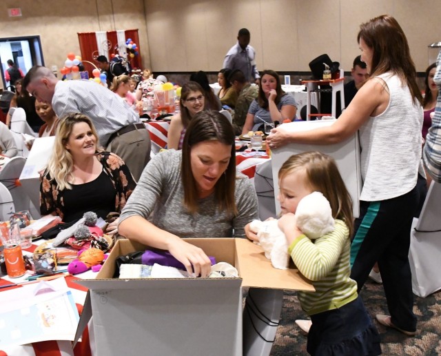 Fort Drum mothers-to-be showered with gifts at a party in their honor