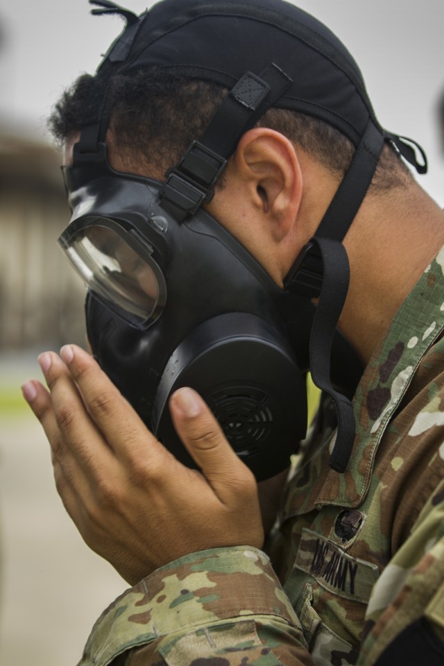 Soldier dons mask before gas chamber