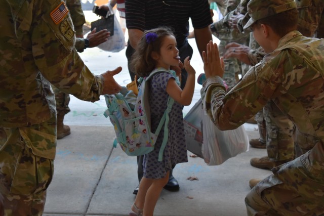 Haircuts and high fives: 20th CBRNE Soldiers welcome area elementary school students back to class