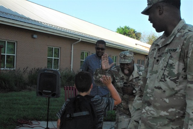 Haircuts and high fives: 20th CBRNE Soldiers welcome area elementary school students back to class
