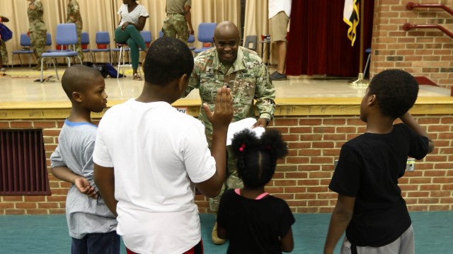 Haircuts and high fives: 20th CBRNE Soldiers welcome area elementary school students back to class