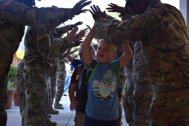 Haircuts and high fives: 20th CBRNE Soldiers welcome area elementary school students back to class