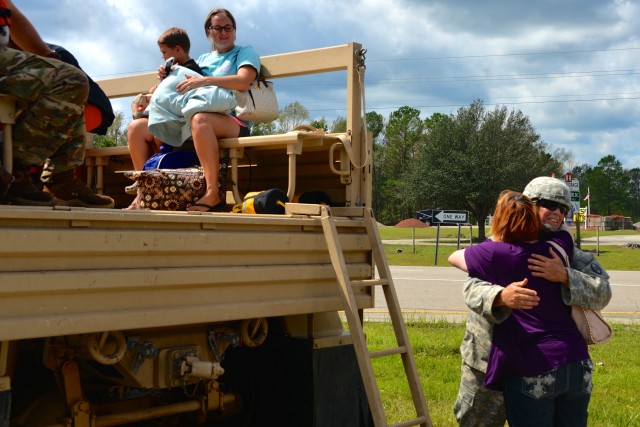 North Carolina Army National Guard Soldiers evavuate residents affected by Hurricane Florence