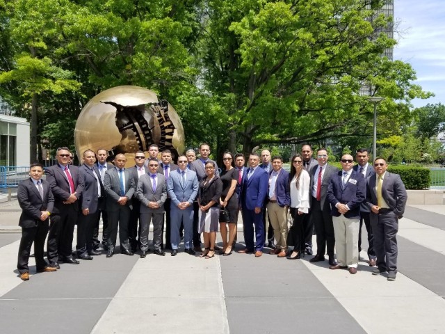Group photo in front of globe