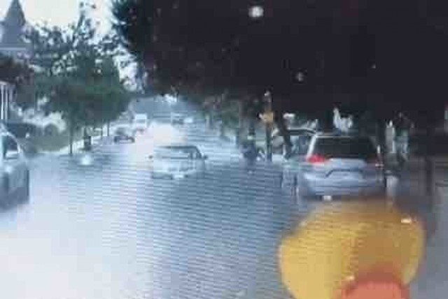 Massachusetts Guard member helps a neighbor in flood