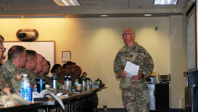 Retired sergeant major of the Army speaks with New York NCOs