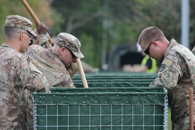 Batesburg Soldiers build HESCO water barrier