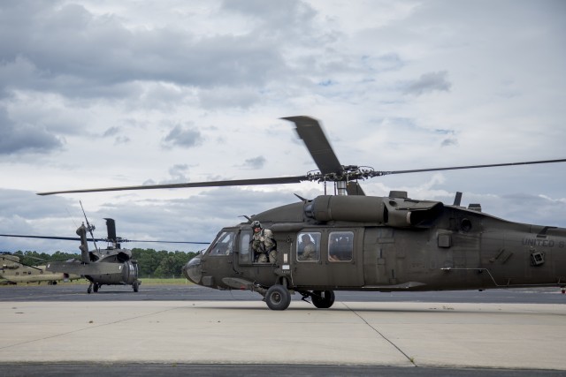 Guardsmen rescue citizens from rising flood waters