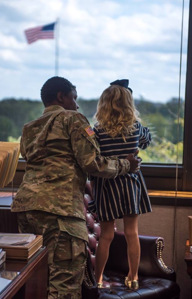 Military child explores Missouri while having ice cream with mayors