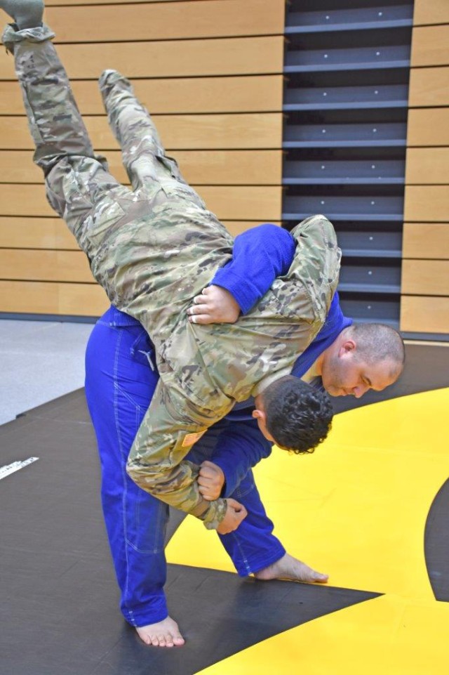 Rob Austin, with the Wiesbaden Brazilian Jiu Jitsu Club, demonstrates techniques