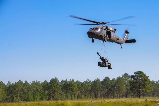 Panther Brigade Artillery Paratroopers Partner with 82nd Combat Aviation Brigade Aviators to Sling Load Howitzers, Conduct Live-Fire Exercise