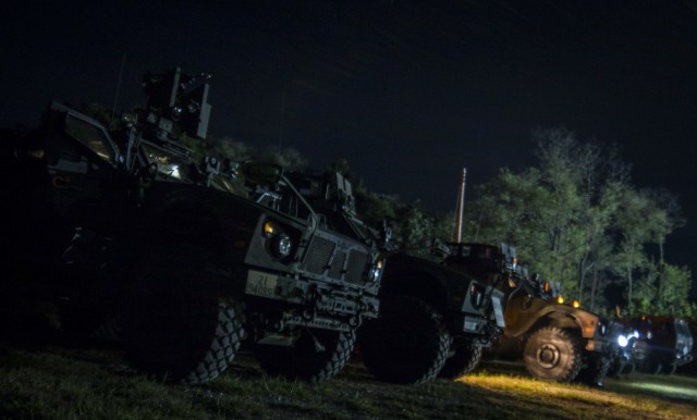 All-Terrain Vehicles Prepare For Night-Fire