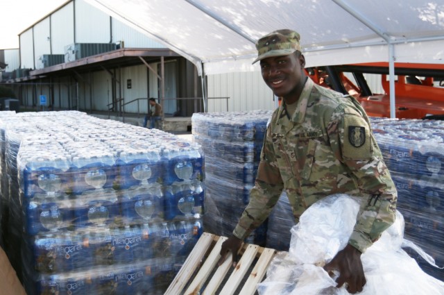 Texas Guard members provide supplies to flood victims