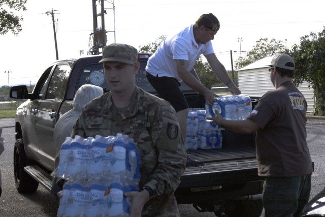 Texas Guard members provide supplies to flood victims