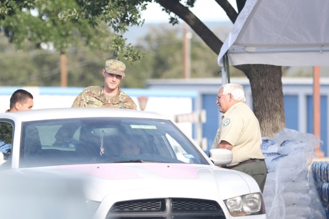 Texas Guard members provide supplies to flood victims