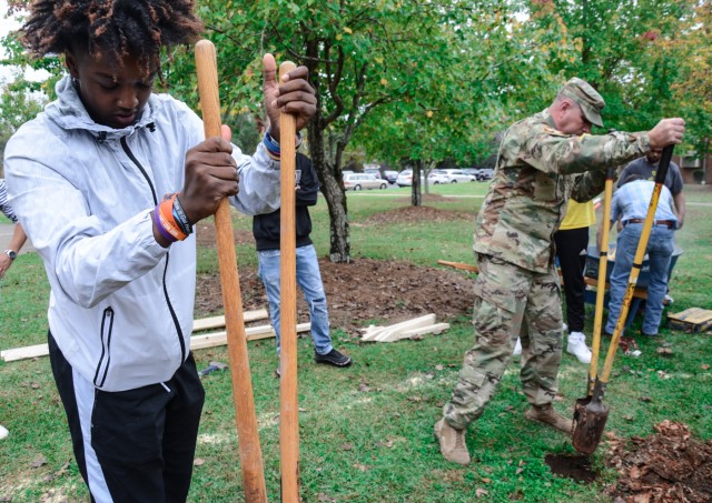 Fort Benning NCOA places PIE sign at local school