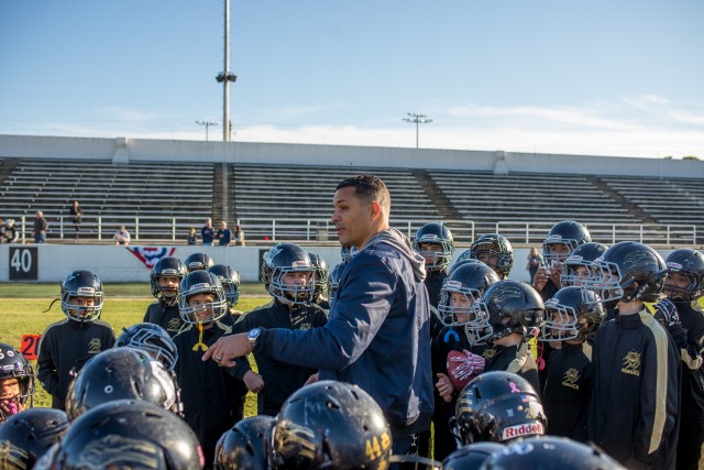 Gonzalez teaches middle school students football