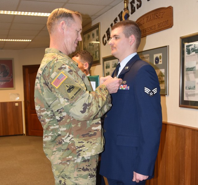 Senior Airman Maxwell Magiera receives Army Achievement medal
