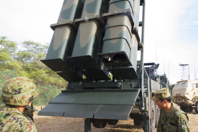 JGSDF members examine the equipment after the live fire launch during RIMPAC