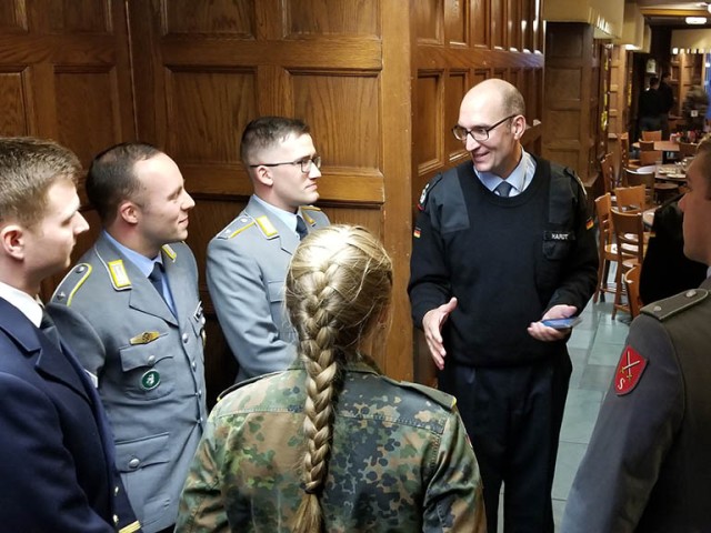 Army War College international fellow German Col. Axel hardt chats with German Cadets attending West Point