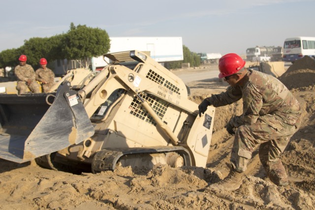 Soldiers repair flood damage across Kuwait