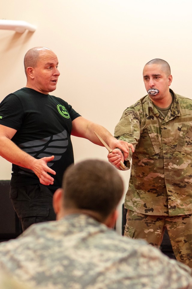 Greenstein teaching hand to knife fighting