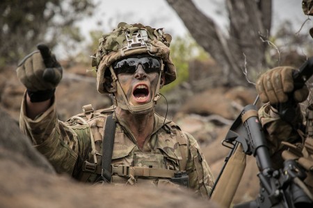 A Soldier signals his platoon during a Combined Arms Live Fire Exercise at Pohakuloa Training Area, Hawaii, May 15, 2018. The CALFEX utilizes all the enablers available to the unit in order to increase interoperability, concentrate combat power...