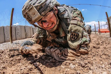 Competitors charge their way through the Medical Training Simulation Center&#39;s qualification lane on the second day of the week long Black Jack Warrior Competition at Fort Bliss, Texas, July 16, 2018.