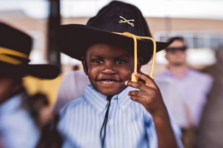 A child attends 1st Squadron, 5th Cavalry Regiment change of command ceremony at Cooper Field, May 23, 2018, at Fort Hood, Texas.