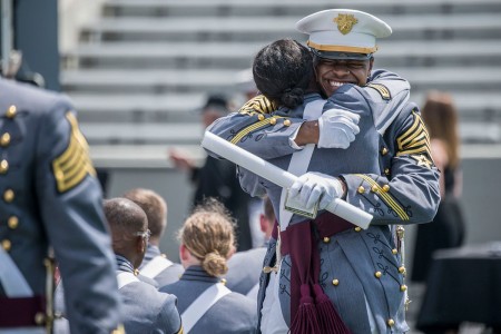 A U.S. Military Academy cadet reacts happily after receiving their diplomas during their graduation ceremony, May 26, 2018, at West Point, N.Y.