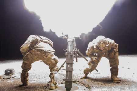 Army indirect fire infantrymen assigned to 4th Infantry Brigade Combat Team (Airborne), 25th Infantry Division, operate the M121 120 mm mortar system during live-fire training at Joint Base Elmendorf-Richardson, Alaska, Nov. 19, 2018. During the...