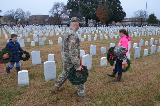 Soldiers and their family members honor the fallen